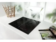 How does a 4 burner induction cooktop work?